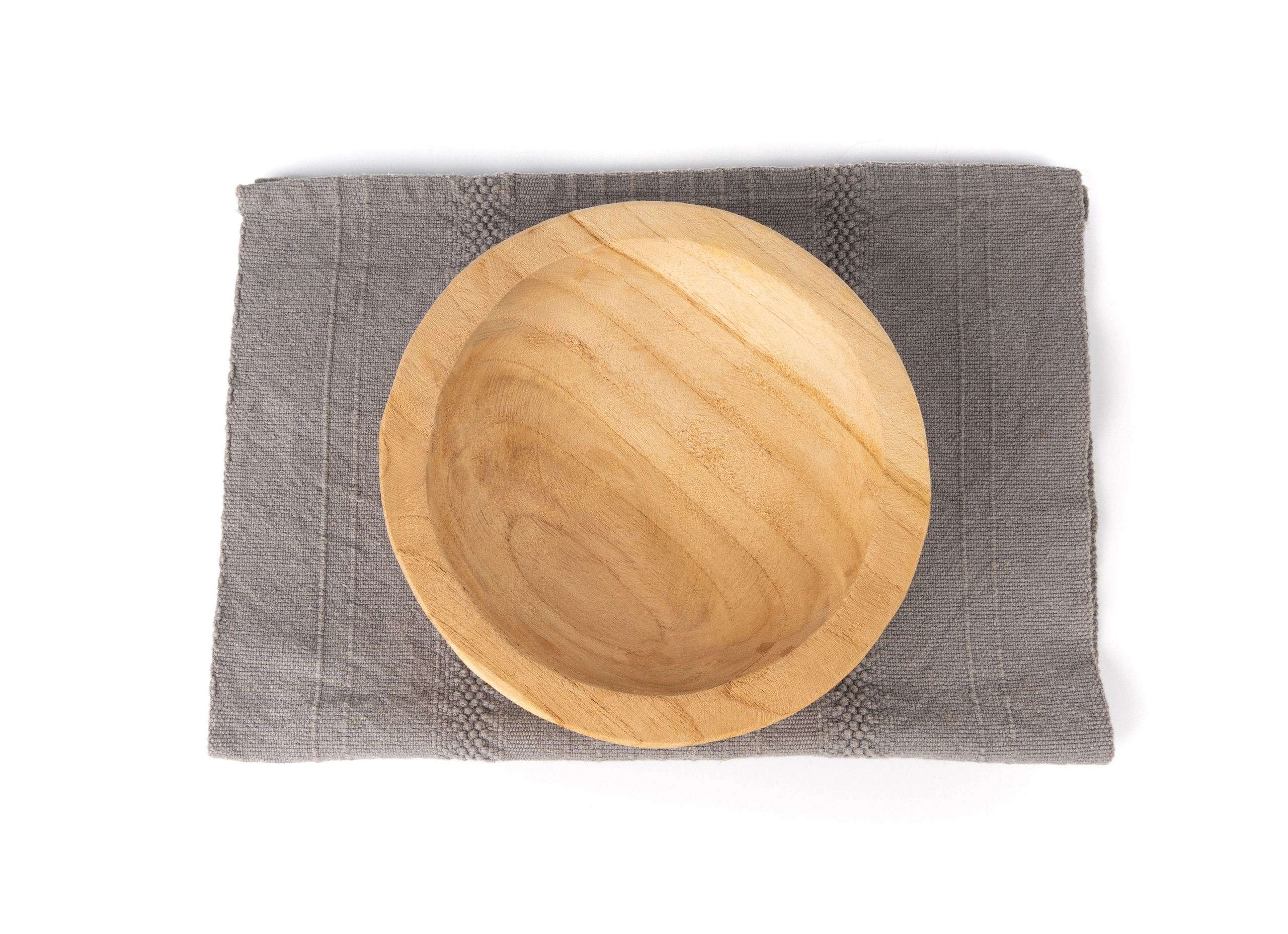 Light plant-based plate and bowl on a neutral cloth